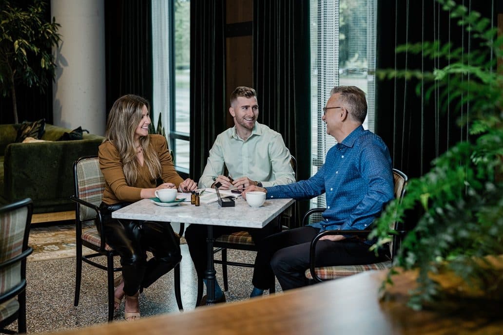 Theresa coaching a venue team over coffee